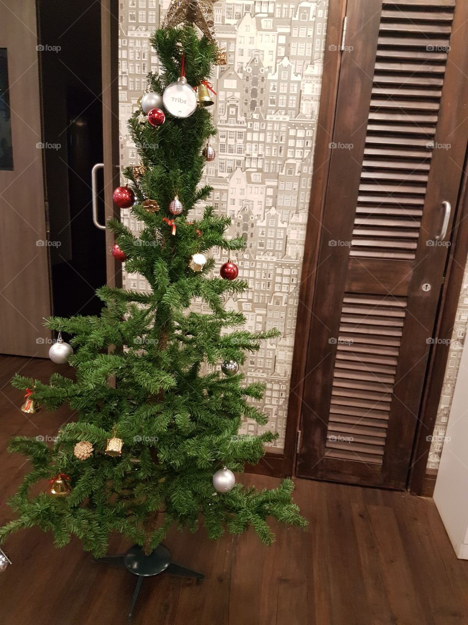 when it is Christmas time people look for the perfect tree the right decorations and ornaments and if you are lucky you get to be with your family through it all.it is just a small simply decorated Christmas tree.