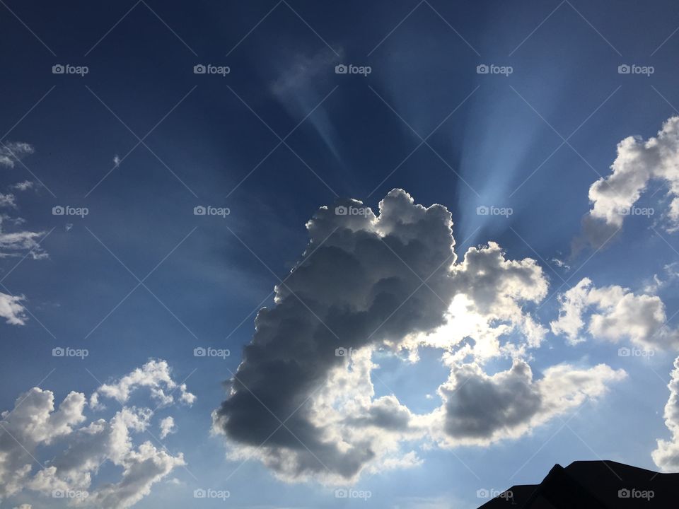 Heavenly sun light seen from behind the clouds
