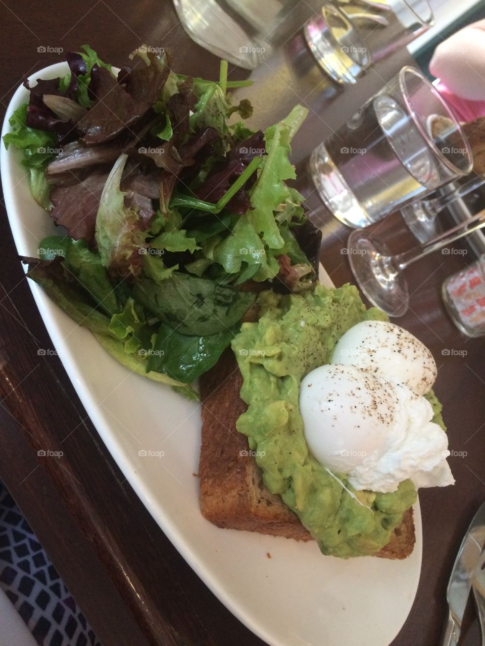 Avocado toast with a salad on the side