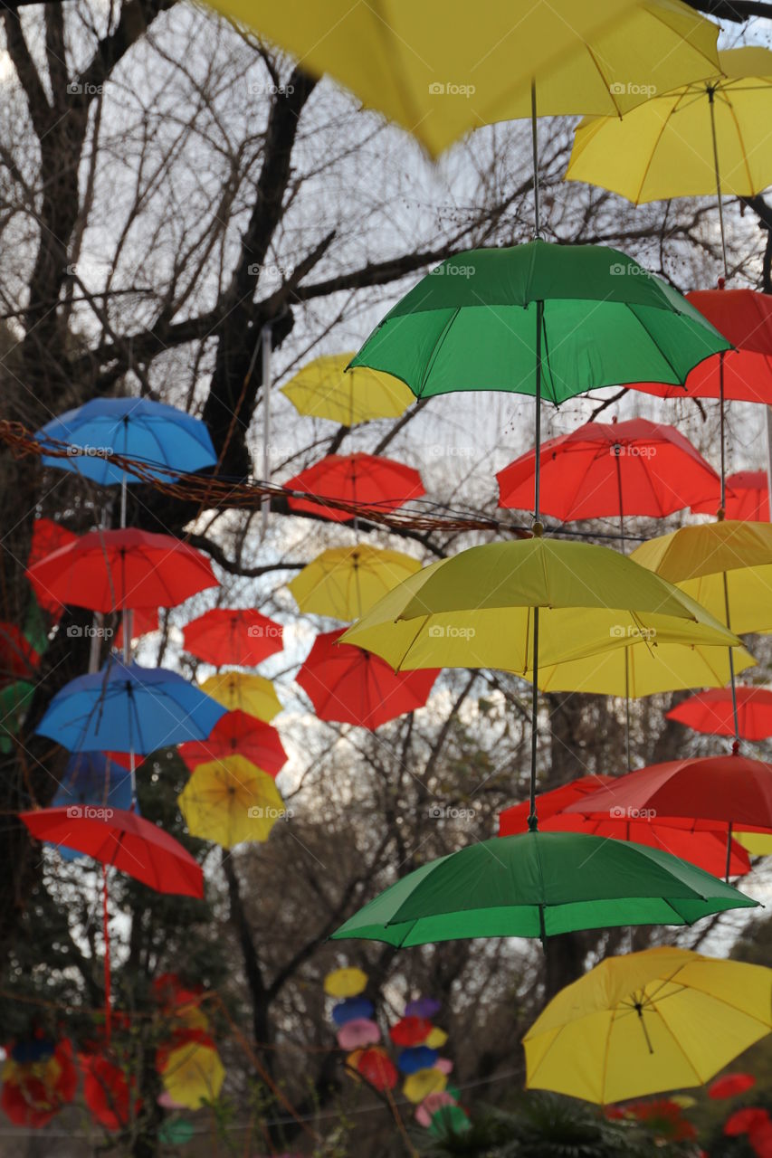 Colorfull umbrellas. A piece of umbrella art at a chines park yunnan.