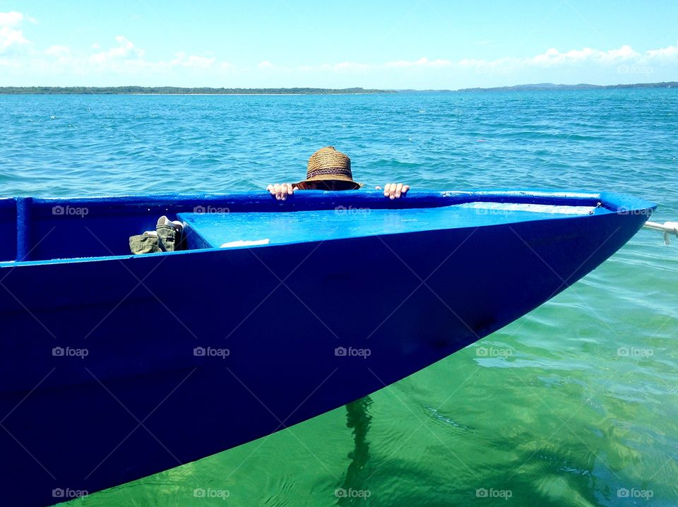 a blue day, in a blue sea, in a blue boat, in a summer month