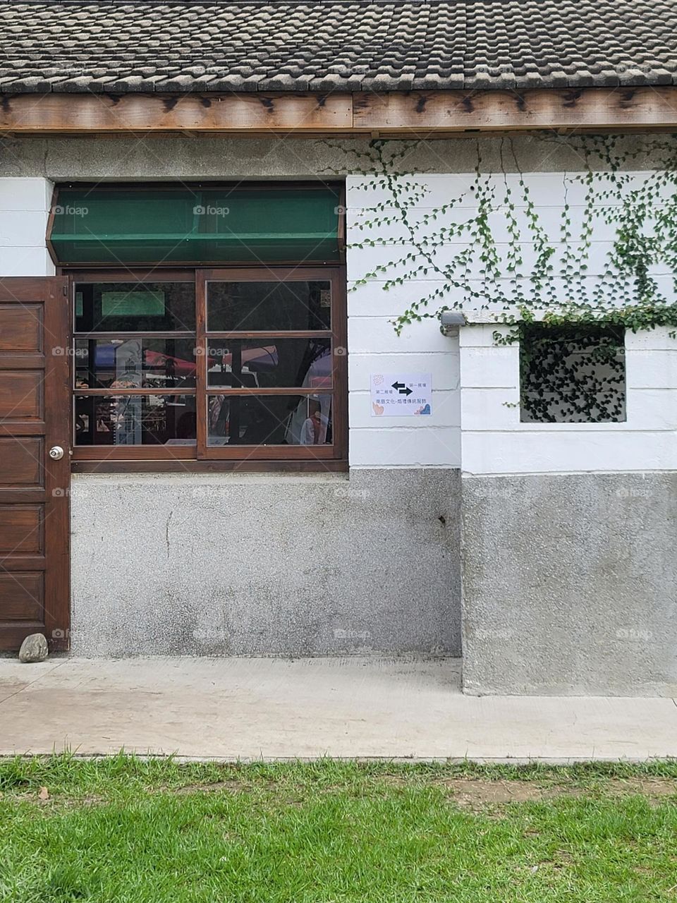 House exterior with sprawling plants