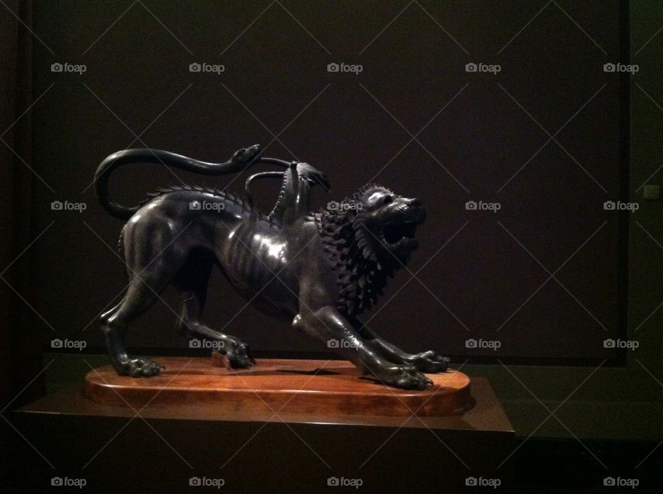 Chimera of Arezzo . Bronze Etruscan sculpture in the Florence archeological museum 