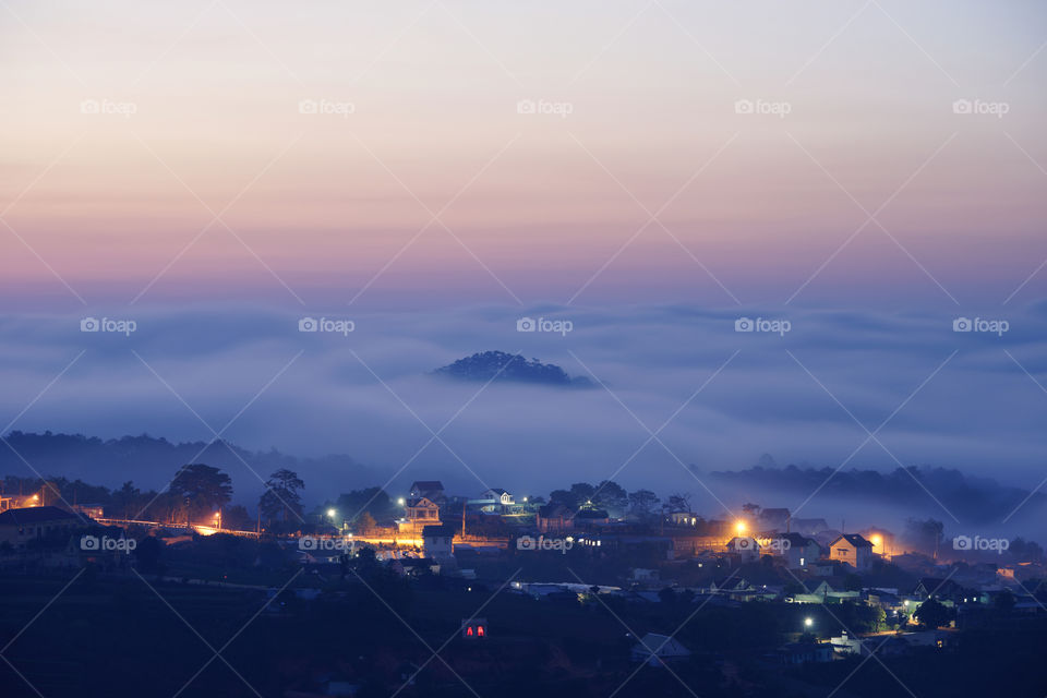 countryside village in misty dawn