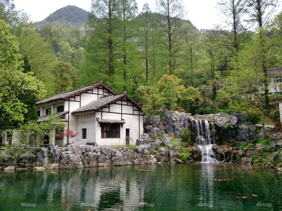The Cottage in a Riverbank. This lovely photo was taken from a national park in Zheijiang Province, China.