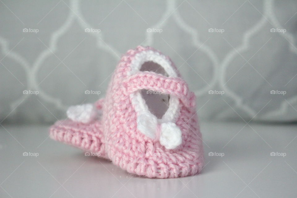 Close-up of pink baby booties