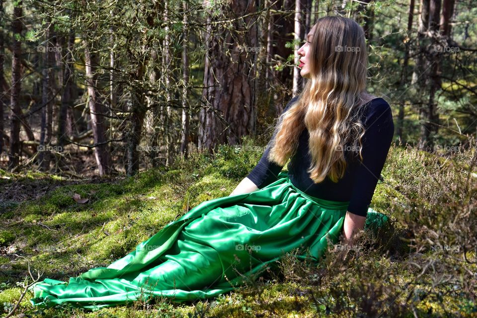 blonde hair woman in the spring forest