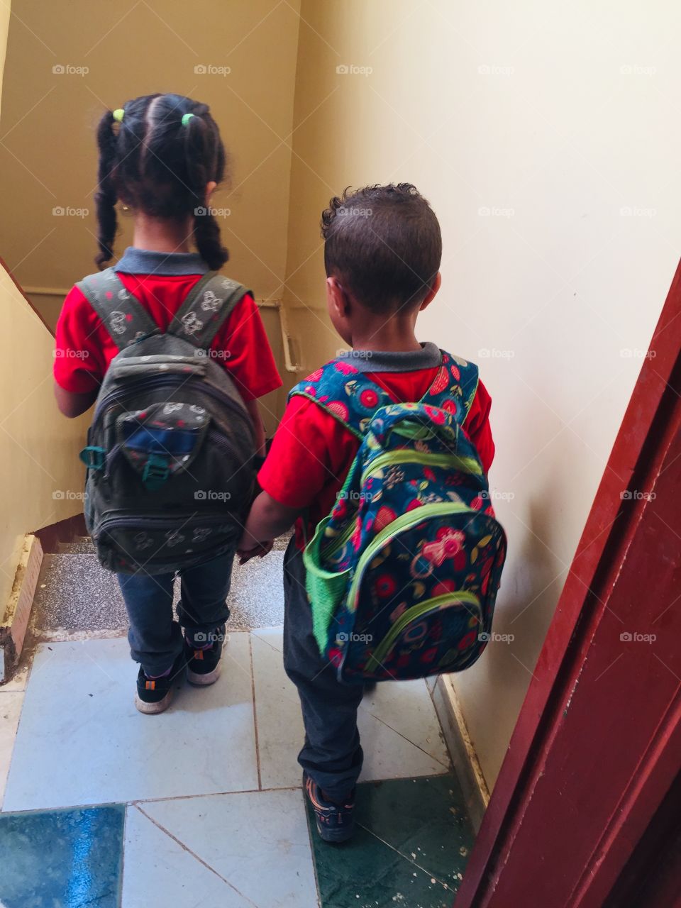 Two children are going to school 