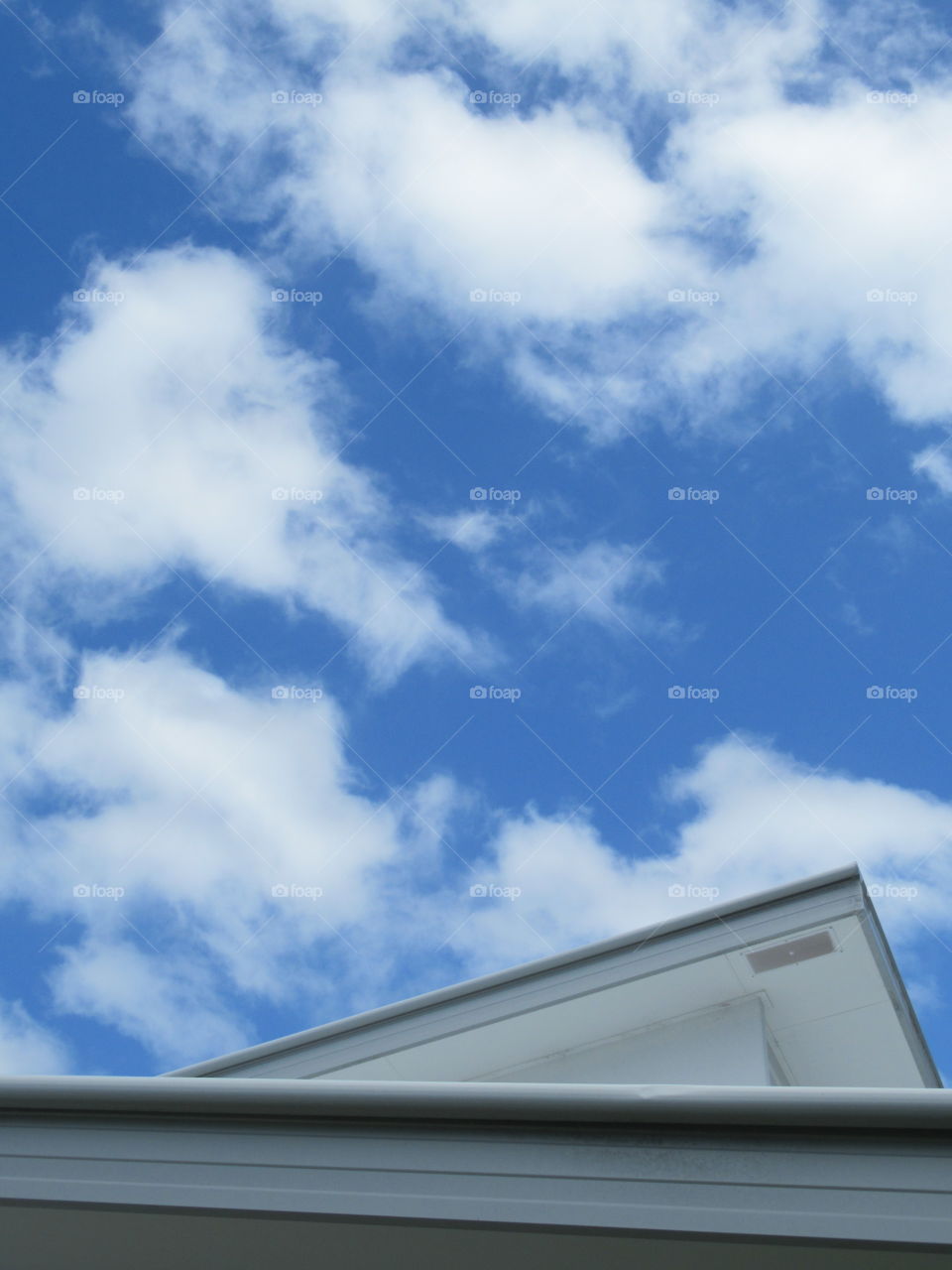 A cloud spotted sky contrasting against beautiful modern design 