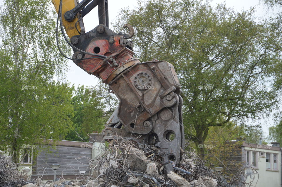 Grab Crane Destroying A House