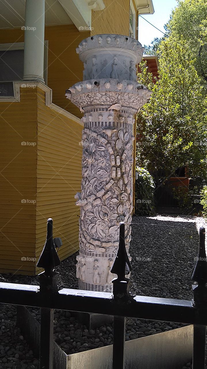 Front yard sculpture. Walking through the neighborhood