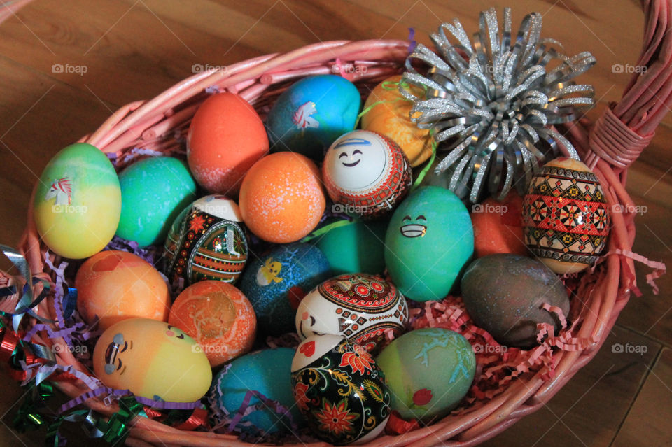 A pink wicker basketful of beautifully dyed and decorated eggs ‘eggs’pertly crafted by my daughters and niece while I was cooking an Easter feast! Great fun had by all!