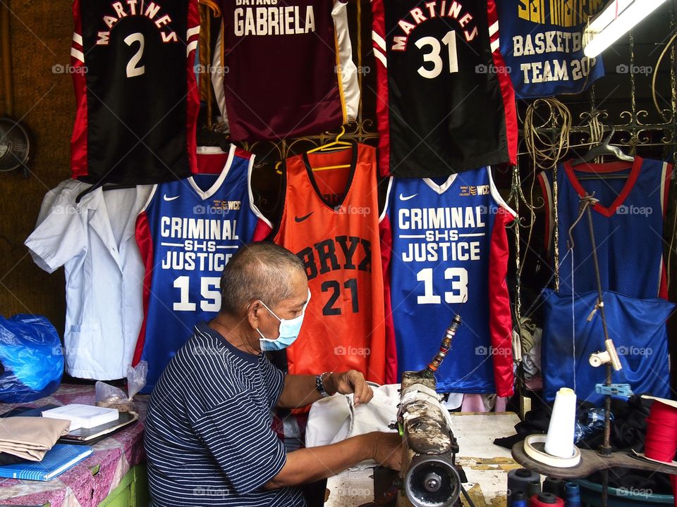 tailor working in his shop