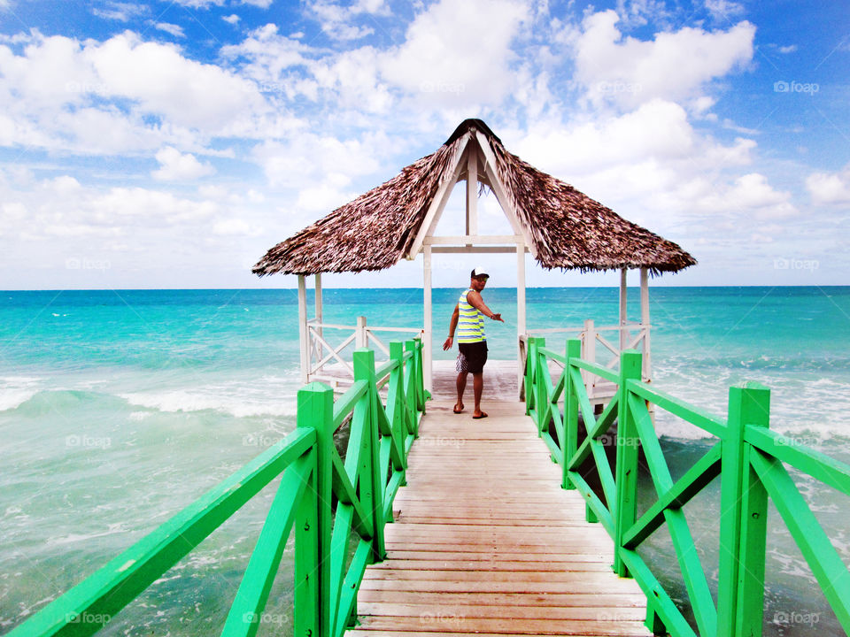 Man posing on wooden pier