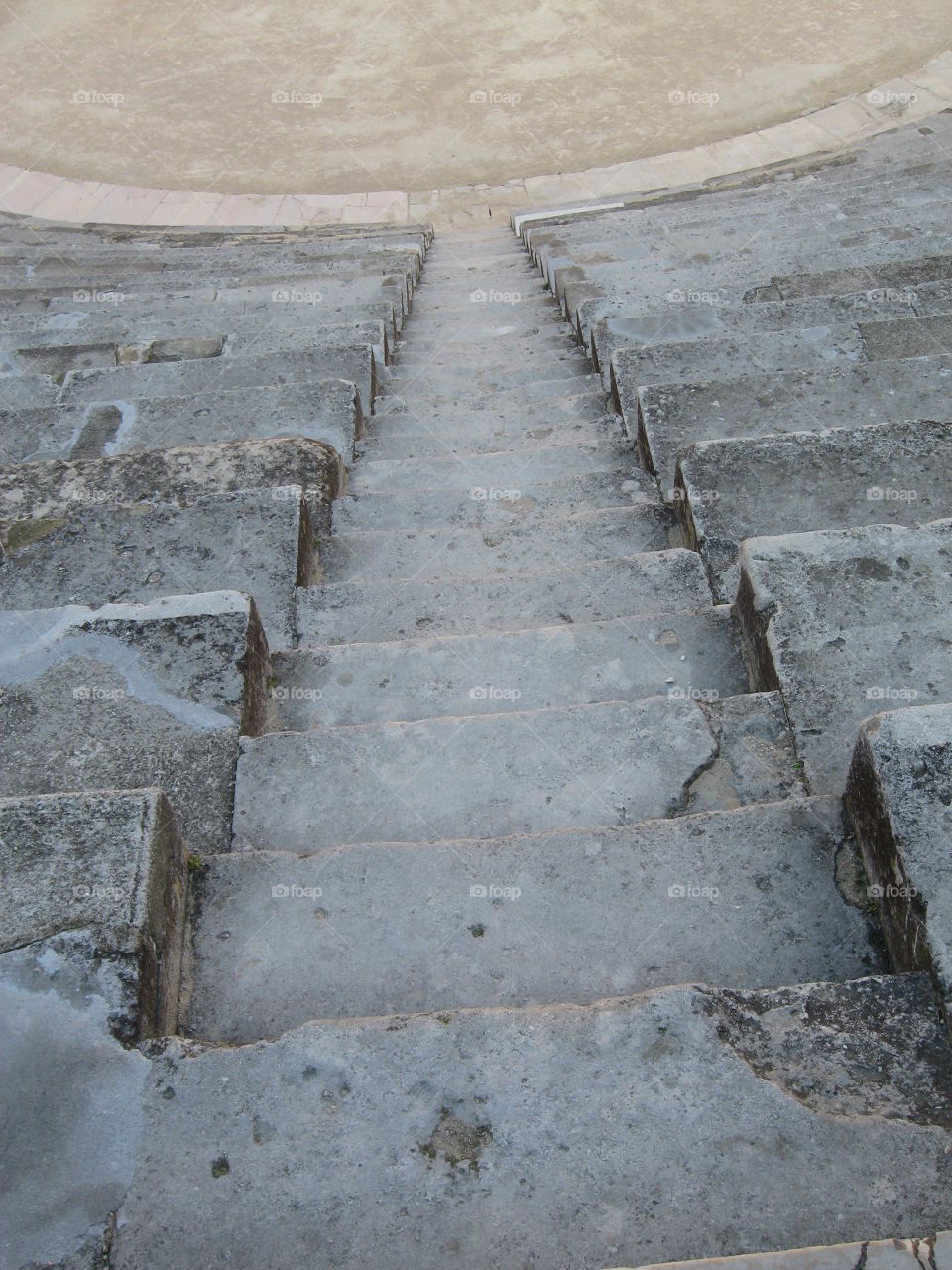 Stone steps. An ancient descending staircase