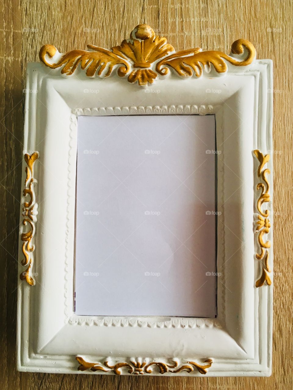 Black photo frame on wooden table