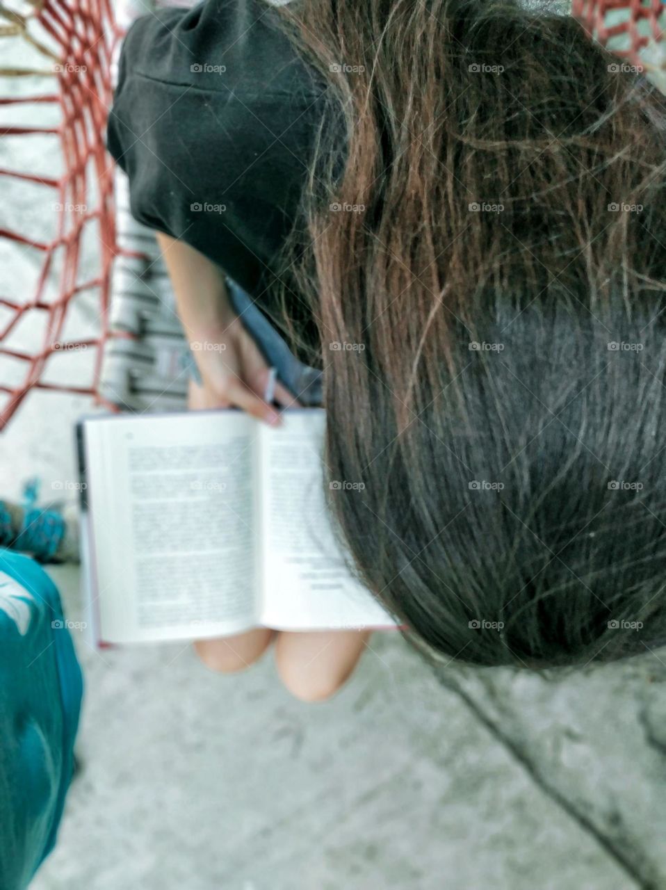 The girl is reading a book