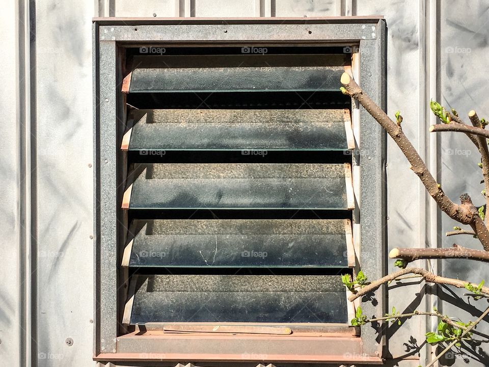 Old tin aluminium slatted vented window open shed window rusted