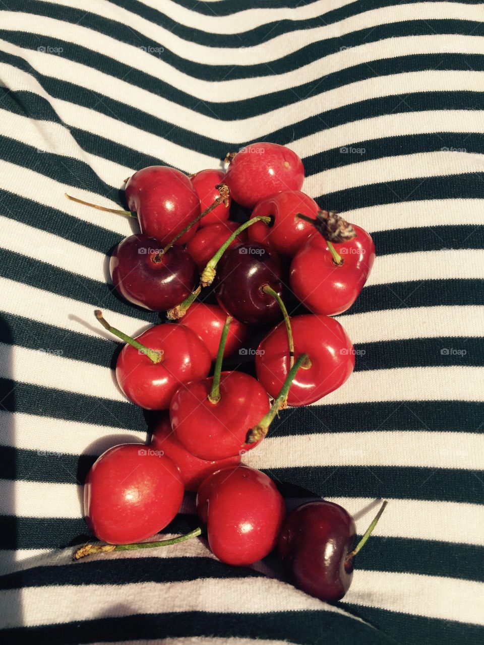 Cherries and stripes. Bought some beautiful cherries from the local farmers stand and the colors were so phenomenal I couldn't help shoot. 