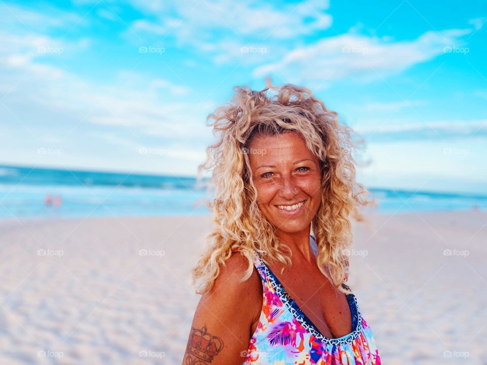 Blonde hair natural woman in the beach 
