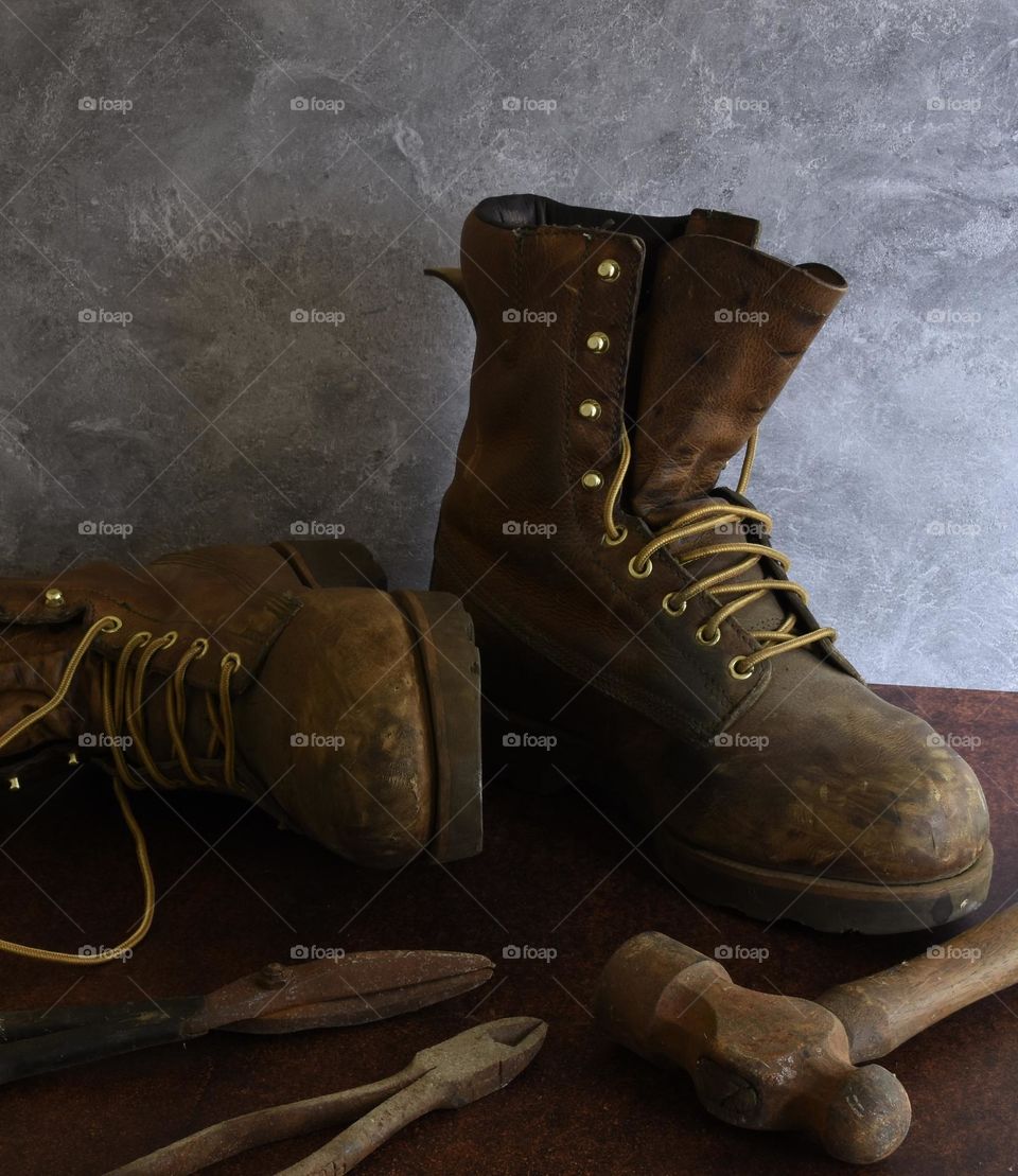 Work boots and tools still life 