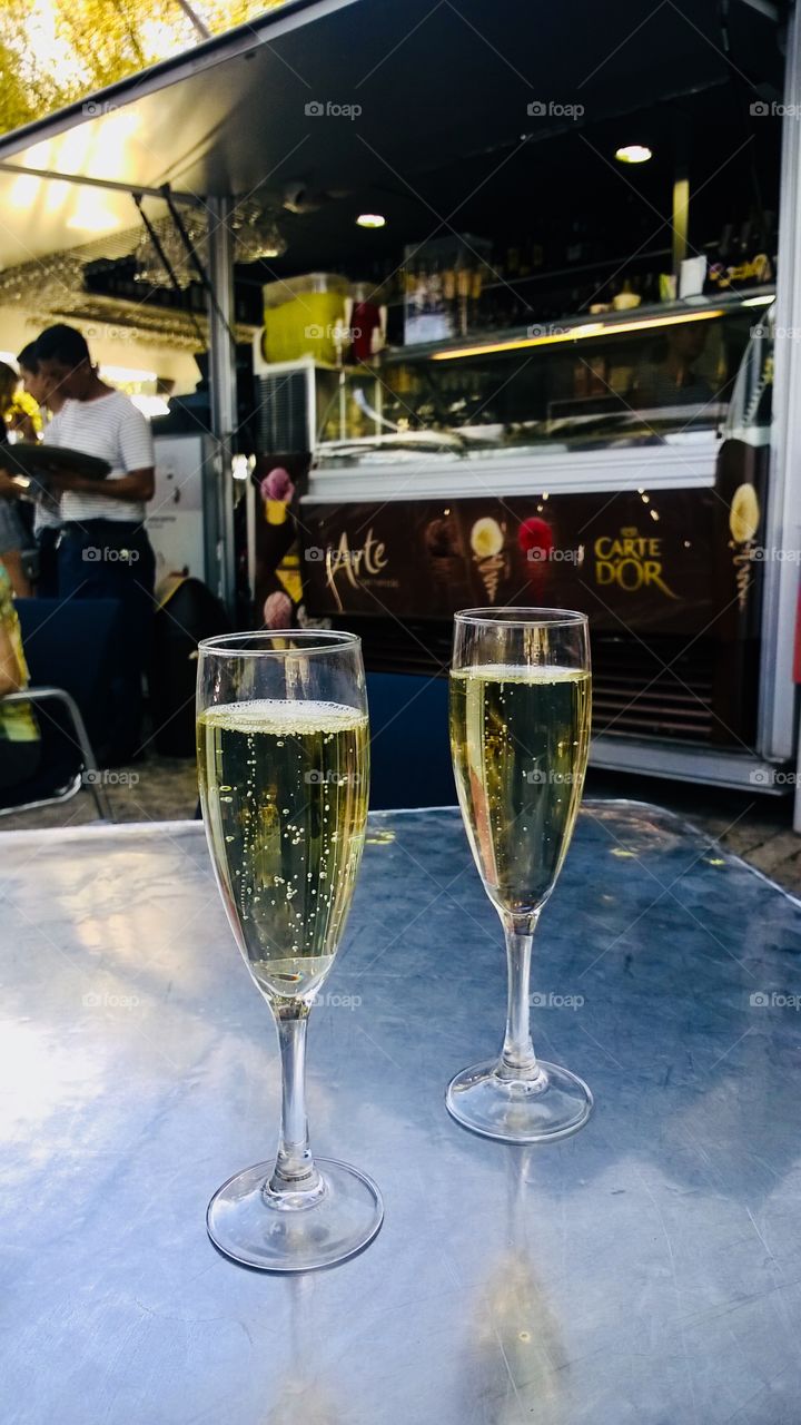 Two glasses of Sparkling wine on cafe table