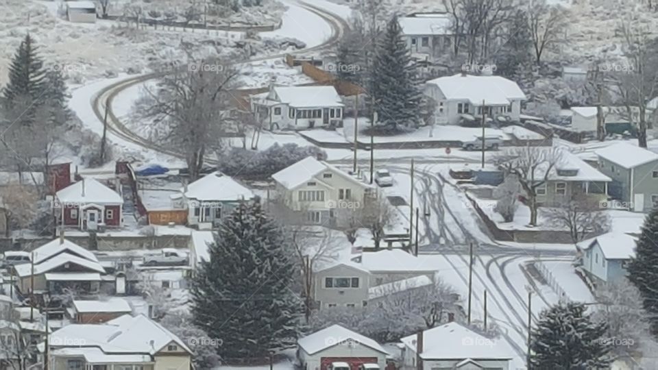 postcard picture of a small town in the United States of America. Ely Nevada from a hill outside of the city on a snowy wintry Day in 2016
