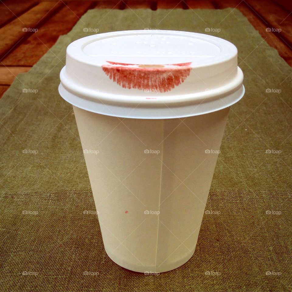 Kiss. Lipstick on cup