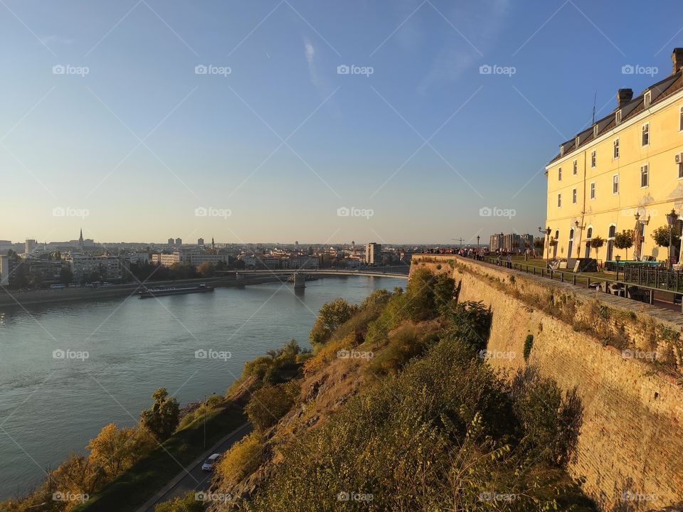 Petrovaradin fortress ramparts and river Danube with bridge in distance