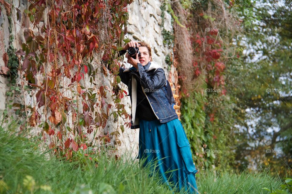 Young woman photographing