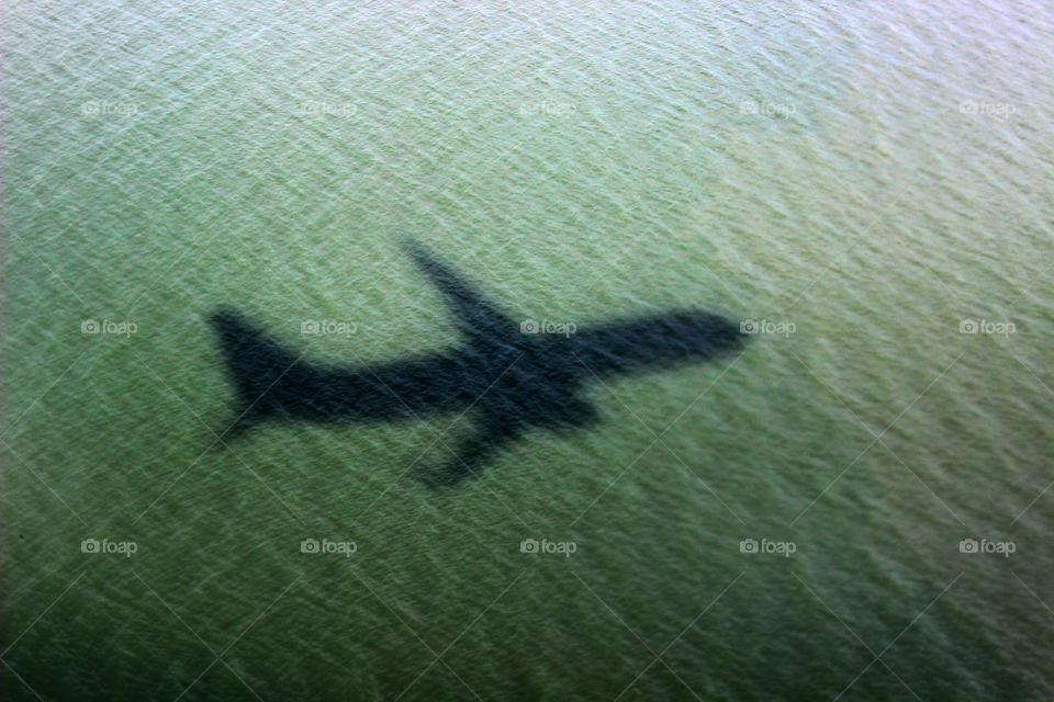 Airplane Shadow Over Water