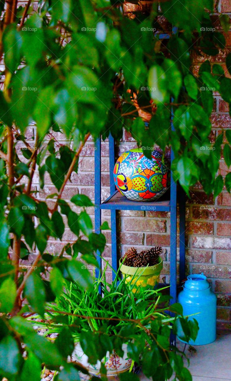 Porch garden with pottery and plants