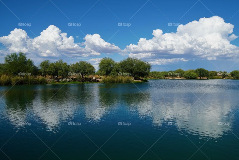 Monsoon clouds start to build on a hot and humid summer day in Arizona promising some short lived relief from the heat.
