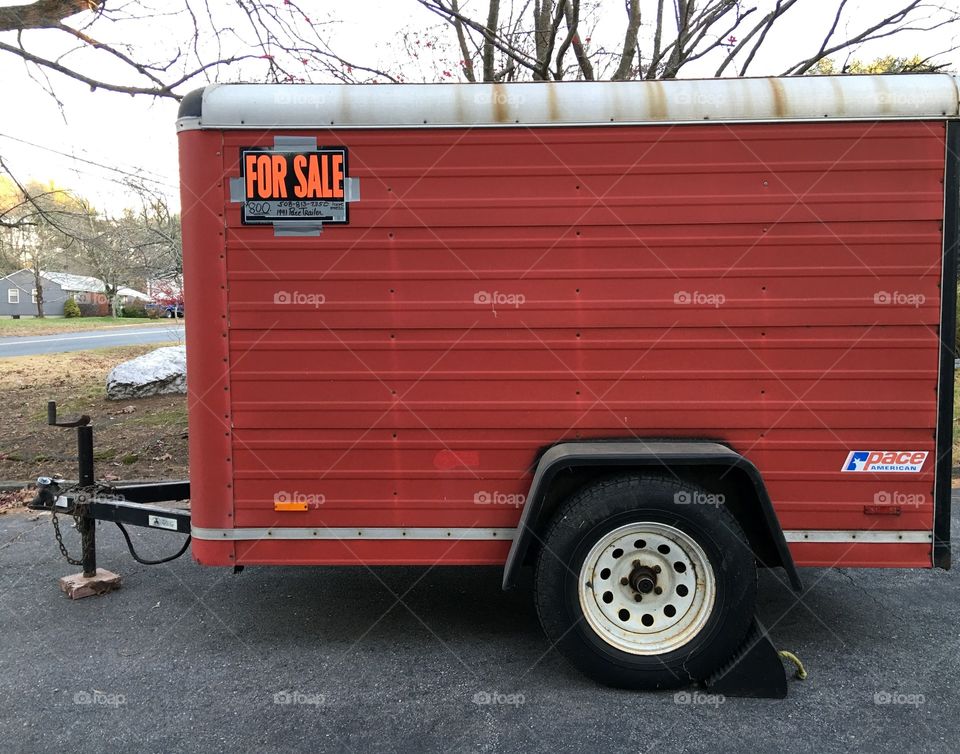 Red pace trailer, pull along.