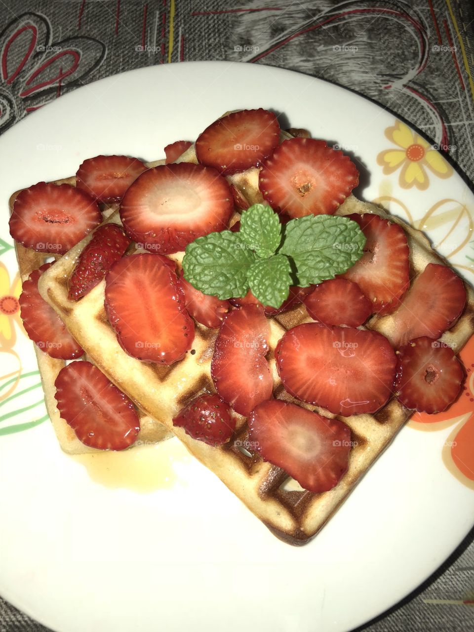 Waffles with strawberries something that my daughter loves 