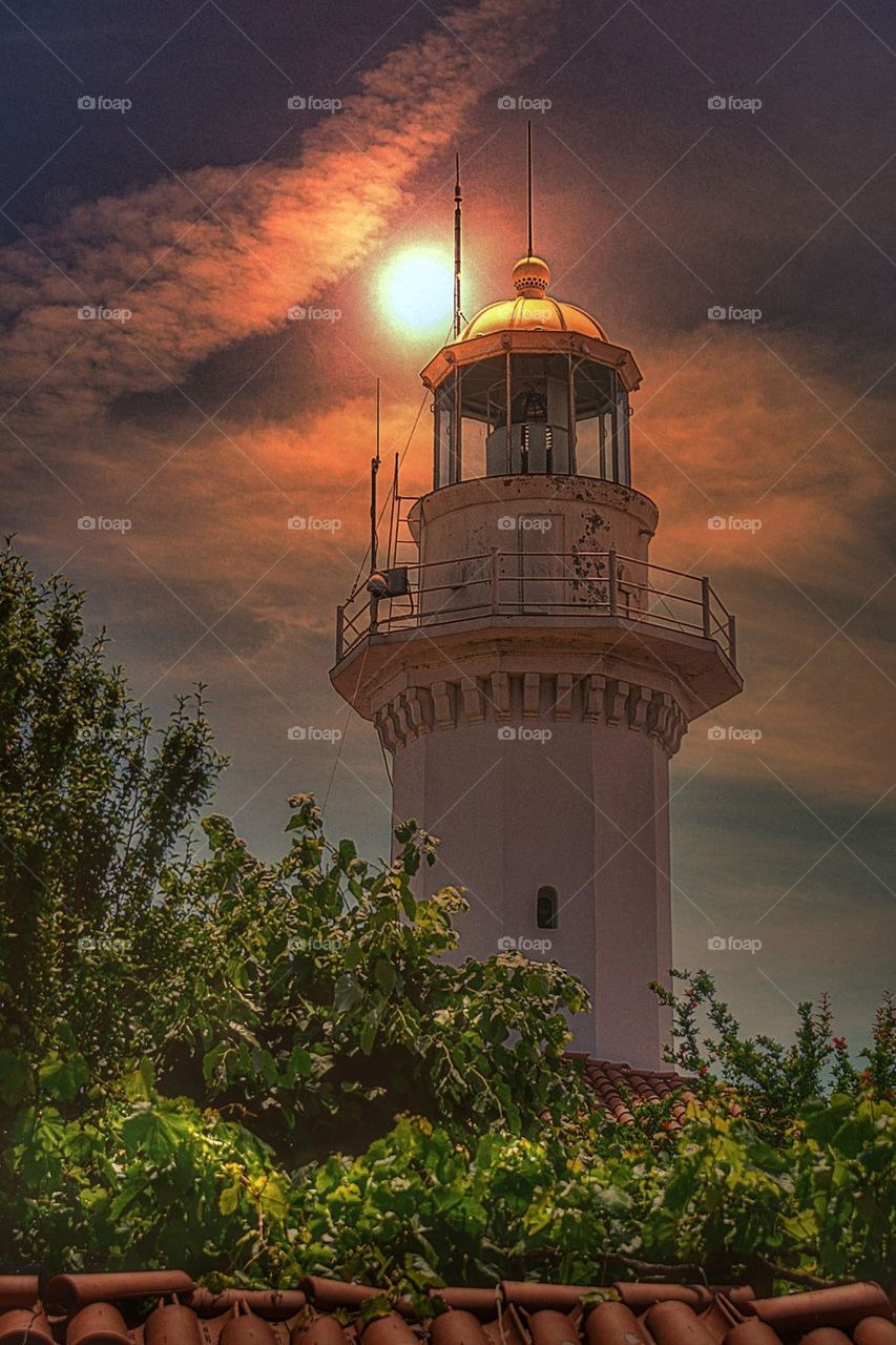 View of lighthouse against sky at sunset