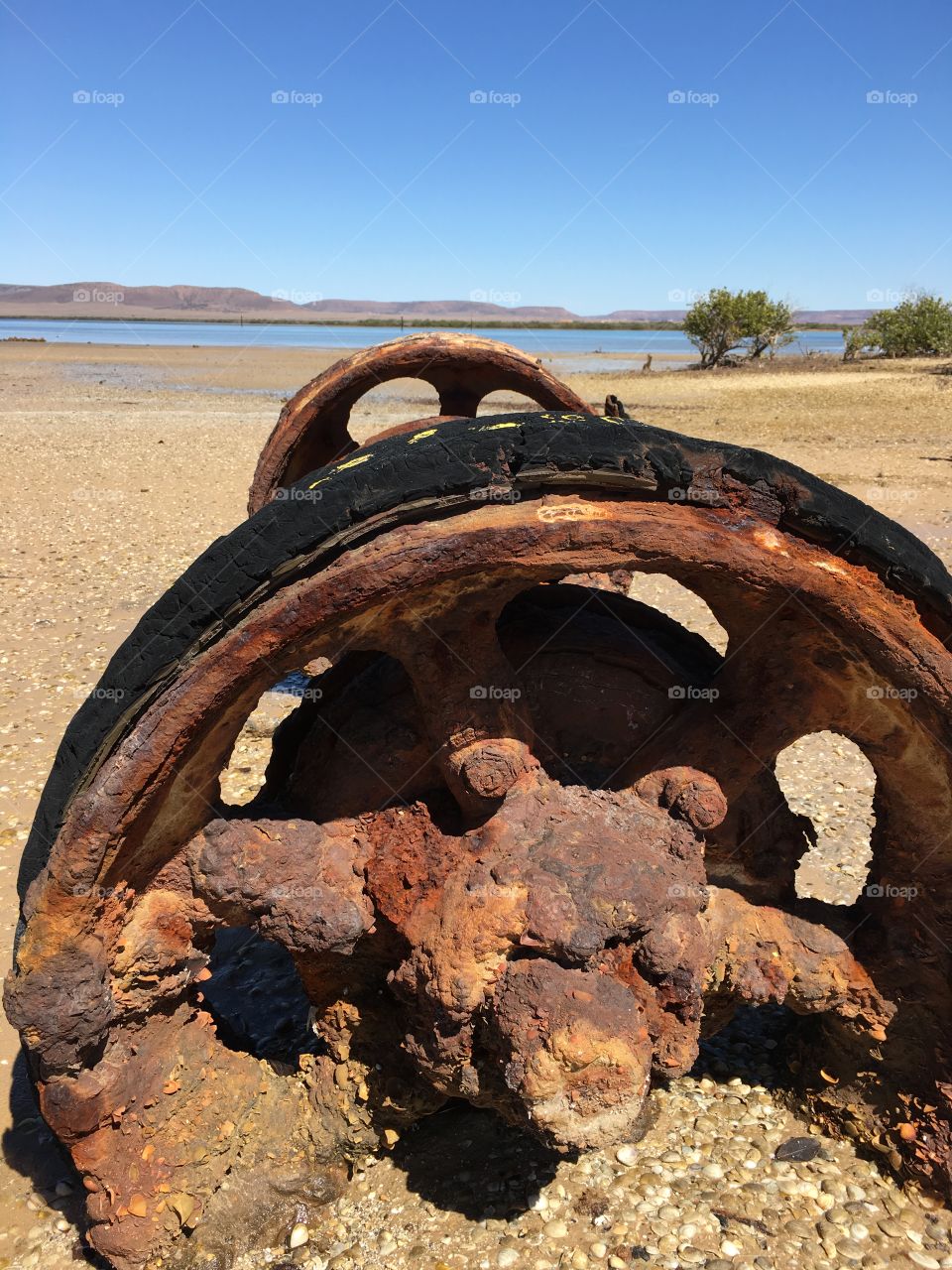 Rusted machinery washed up on Australian shore at low tide