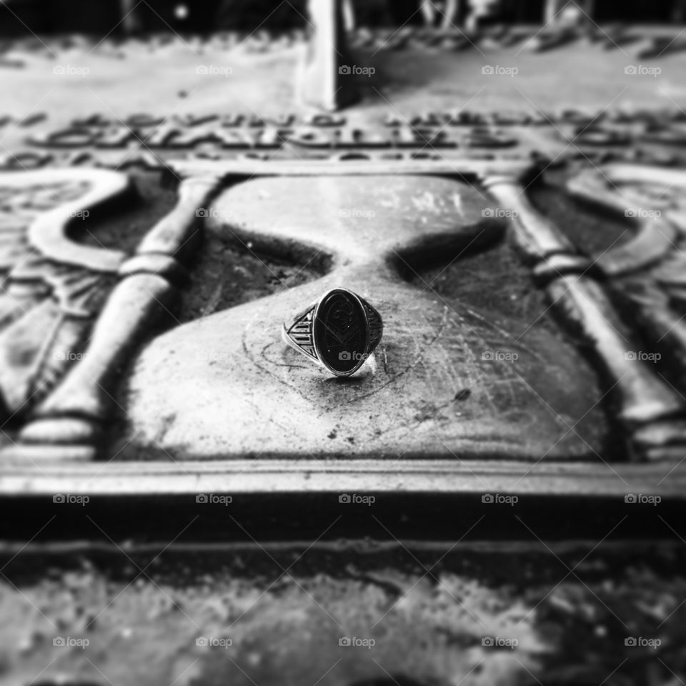 Class ring on a sun dial