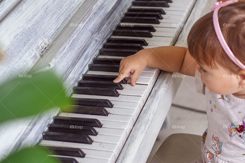 girl playing the piano