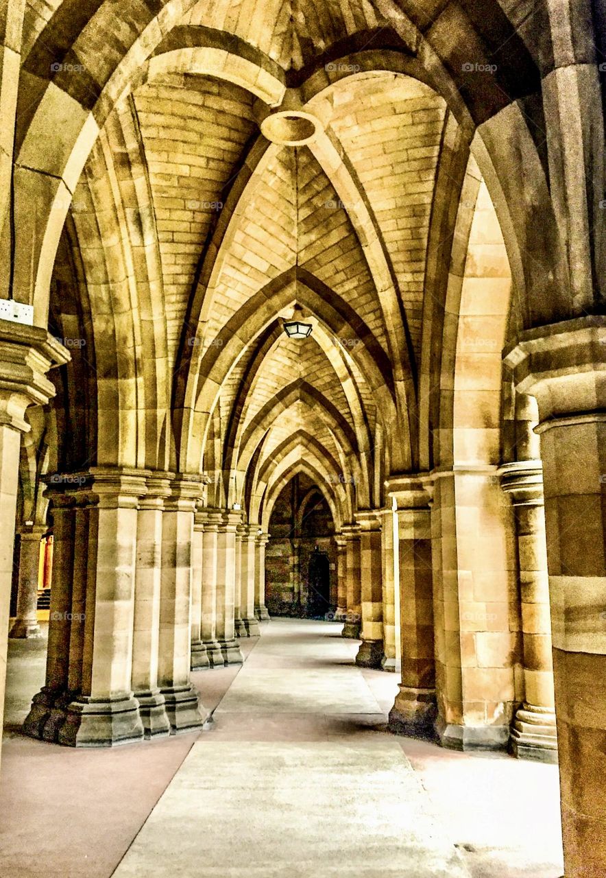 The iconic fluted column archways of The Cloisters at the University of Glasgow.