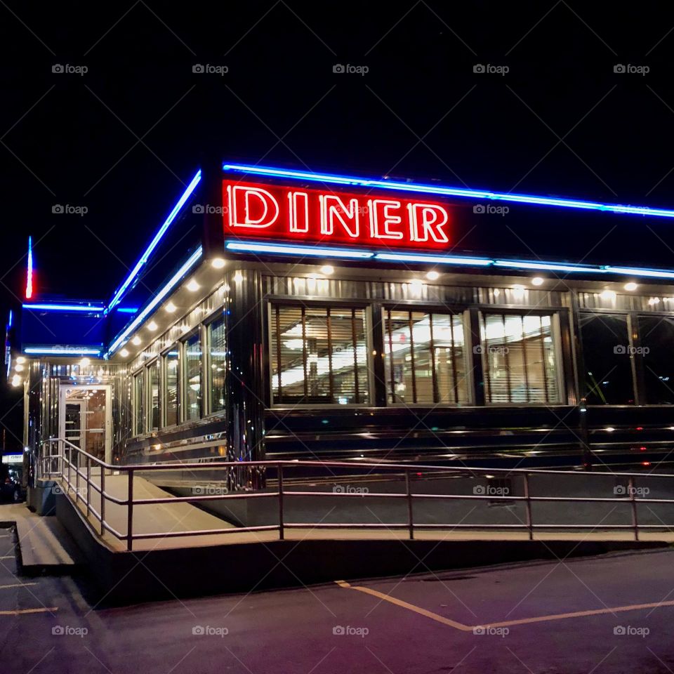 Diner at night time, looking through the windows of a diner, Diner in New York at night, twinkling lights at nighttime in the windows of a diner, eating out at night