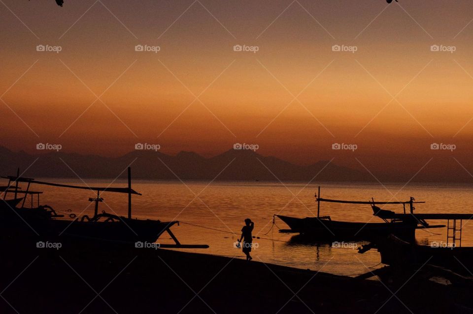 Sunset fisherman Lovina Beach Bali 