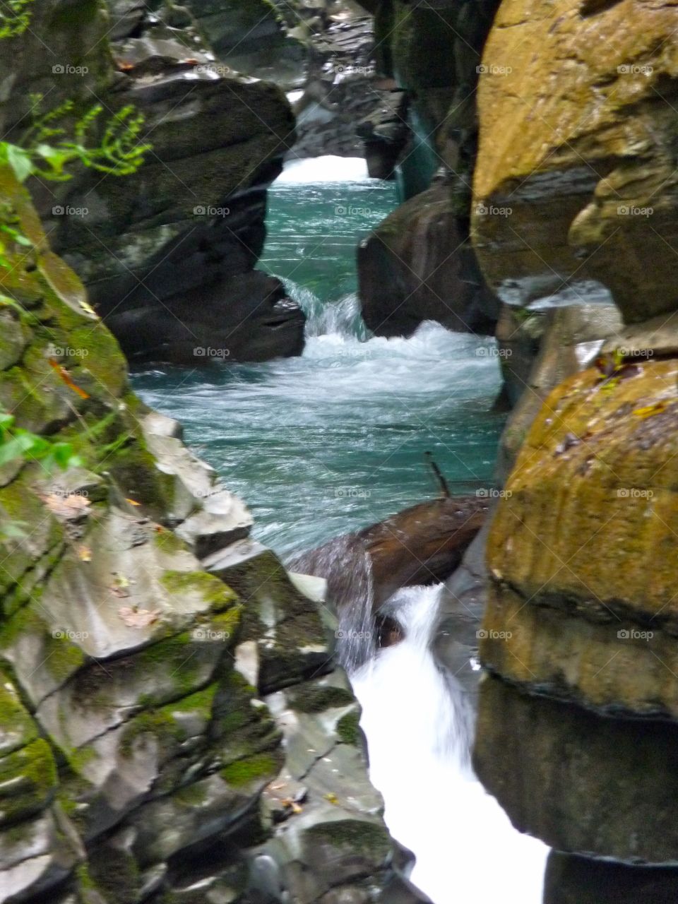 Mountain stream and stones. Stream making its way through the huge stones in the Swiss Alpes