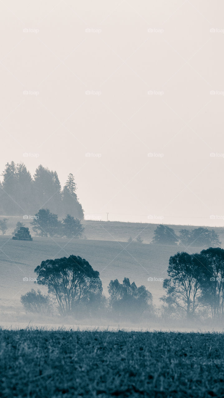 An inspiring mountain landscape. Tatry mountains in Slovakia. A beautiful wallpaper for smartphone screen. Monochrome blue abstract gradient with perspective.