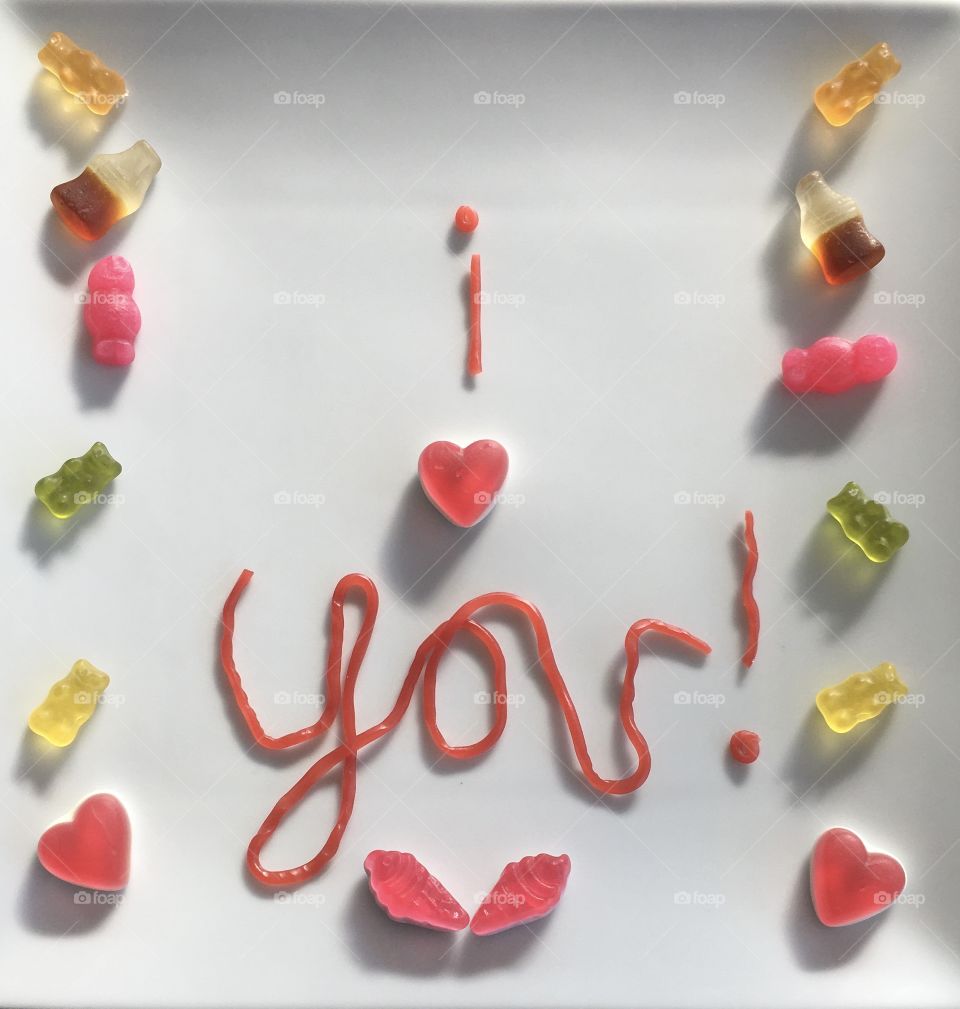 Red strawberry laces and a handful of colourful sweets delivering a heartfelt message to my two little ones. 