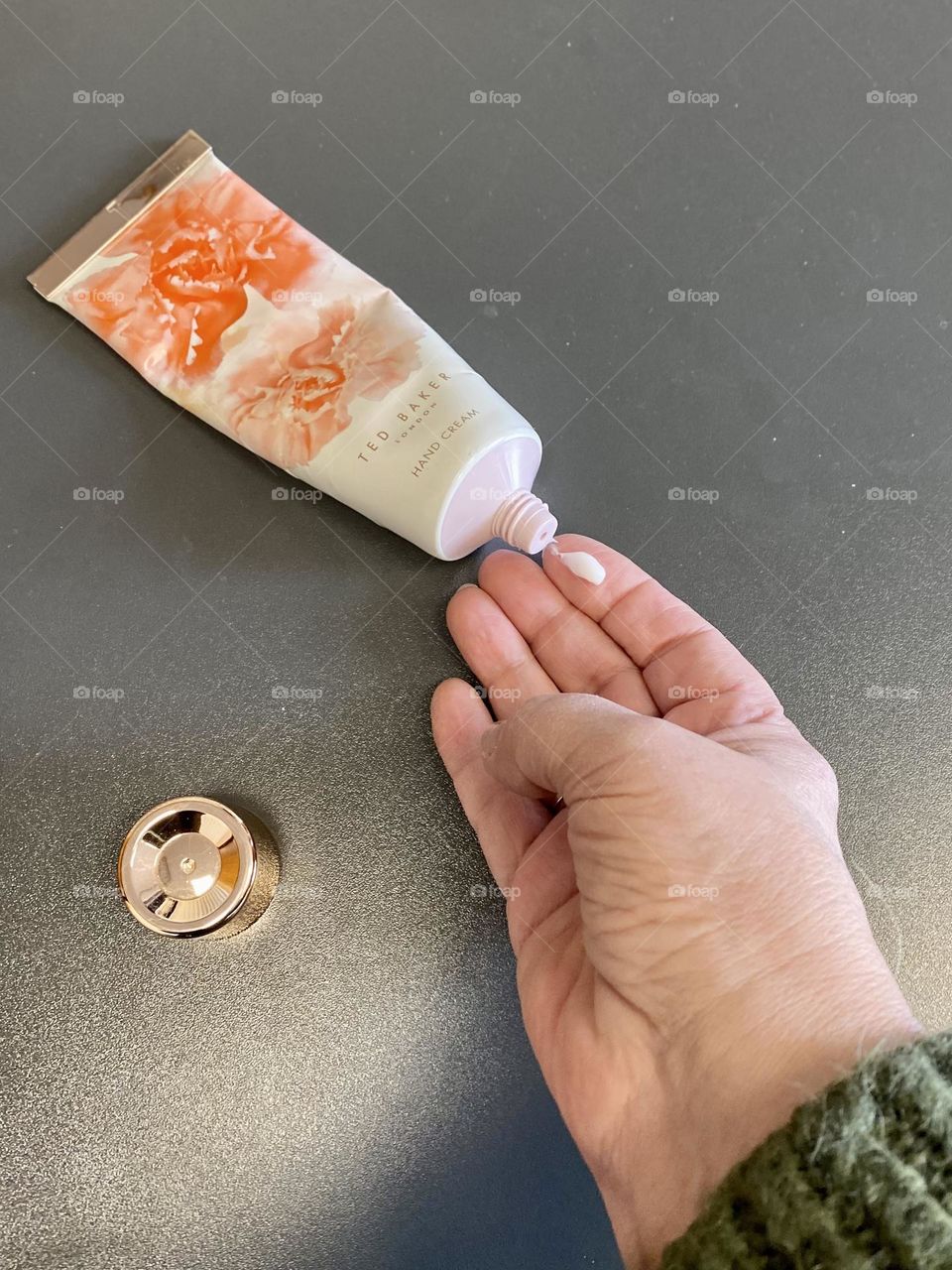 Hand cream on hand