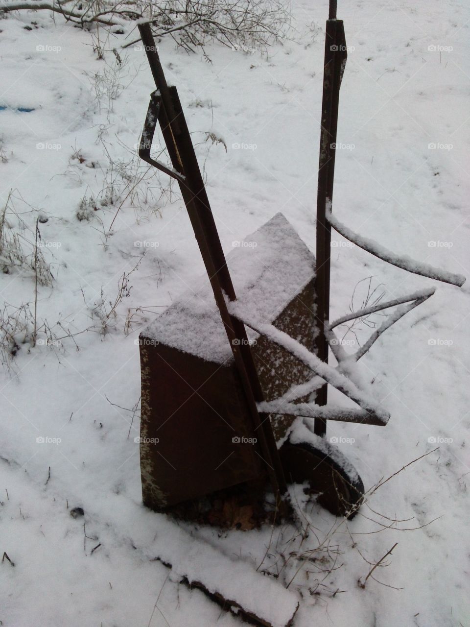 loneliness of rusty wheelbarrow