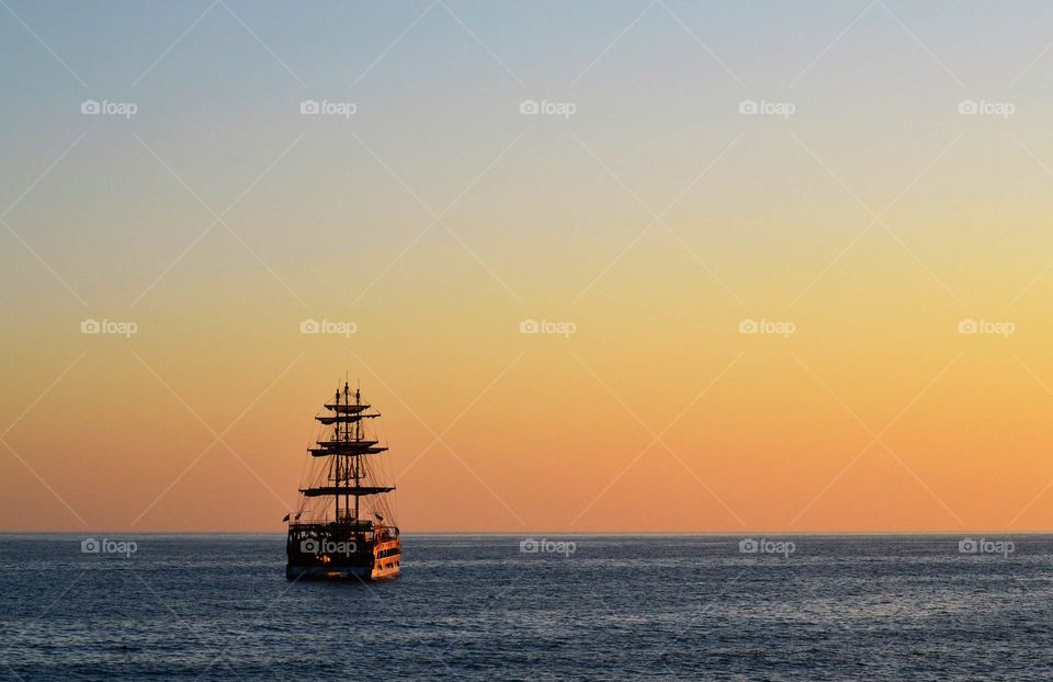 ship sailing off into the sunset in Alanya turkey.
