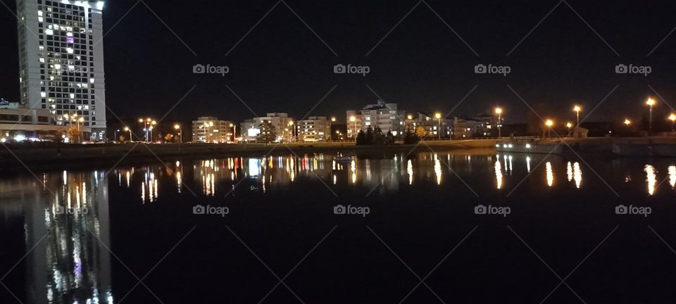 beautiful night light street view, windows magic light, cityscape and reflection in river