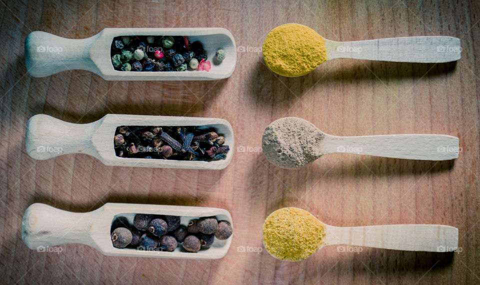 Raw pasta with ingredients and wooden accessories